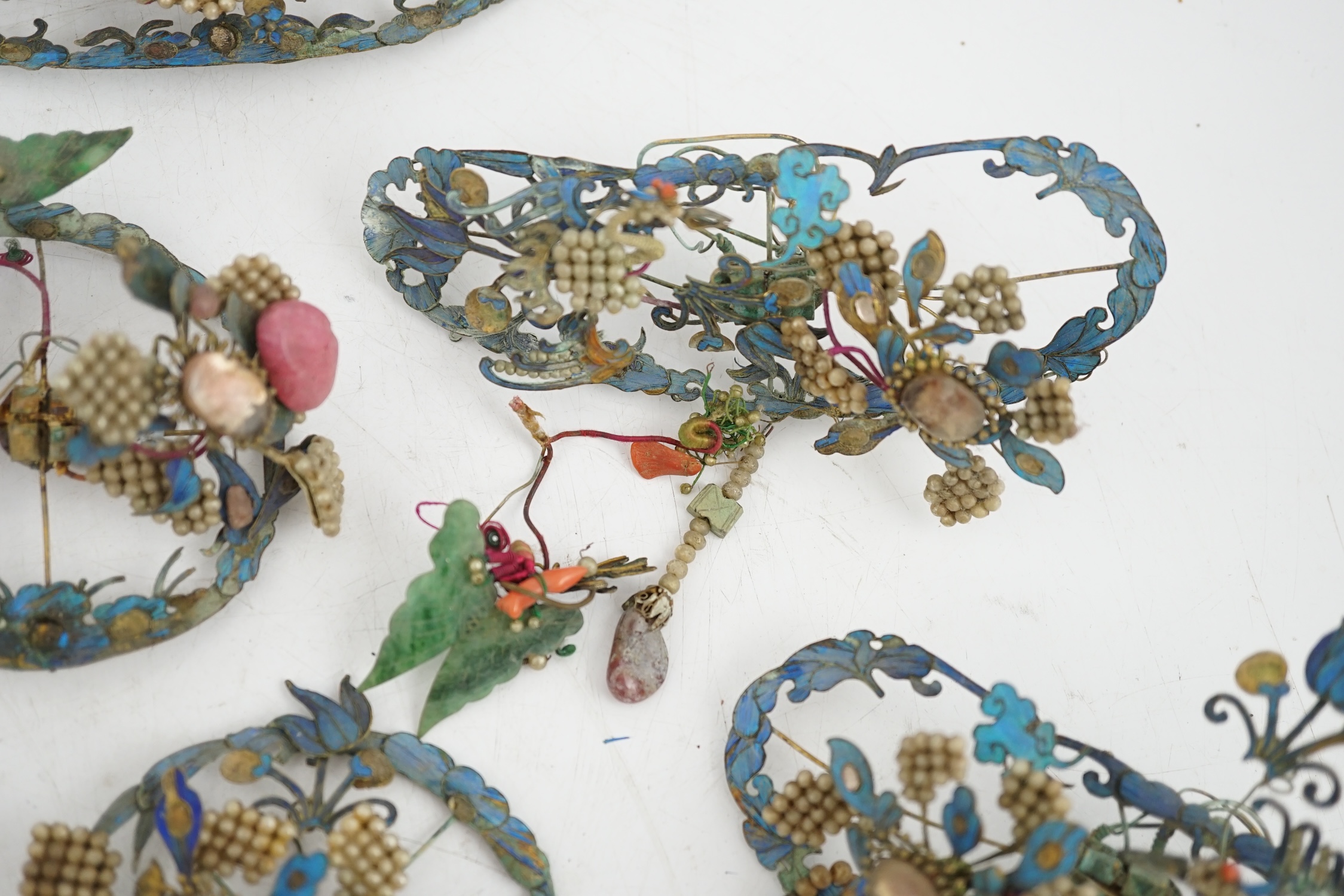 A group of eight Chinese kingfisher feather, jade, seed pearl, coral and hardstone mounted headdresses and ornaments, late Qing dynasty, some losses